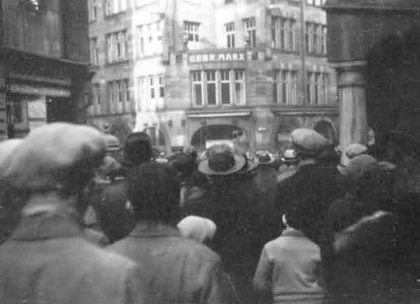 A hostile crowd in front of the Jewish store Gebrueder Marx