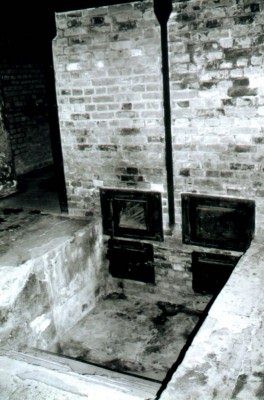 Back of ovens with ashes pit in Auschwitz I Museum