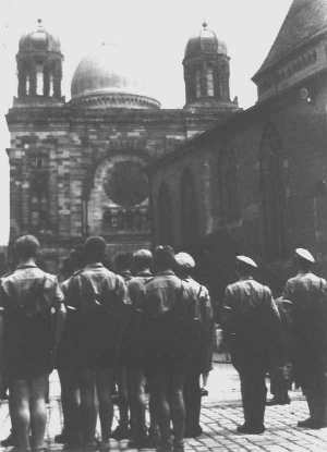 Hitler Youth attending the demolition of the synagogue at Hans-Sachs-Platz, August 1938