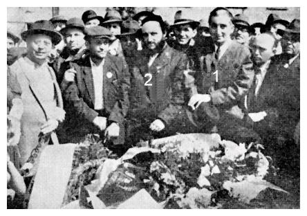 Zag019.jpg [35 KB] - Survivors place flowers on the memorial stone